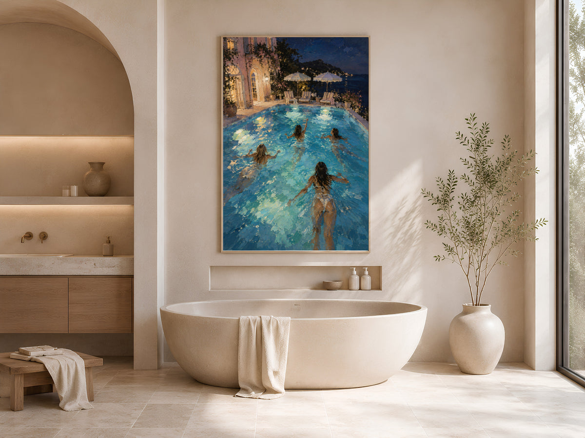 Night swim wall art framed above a freestanding tub in a warm neutral bathroom