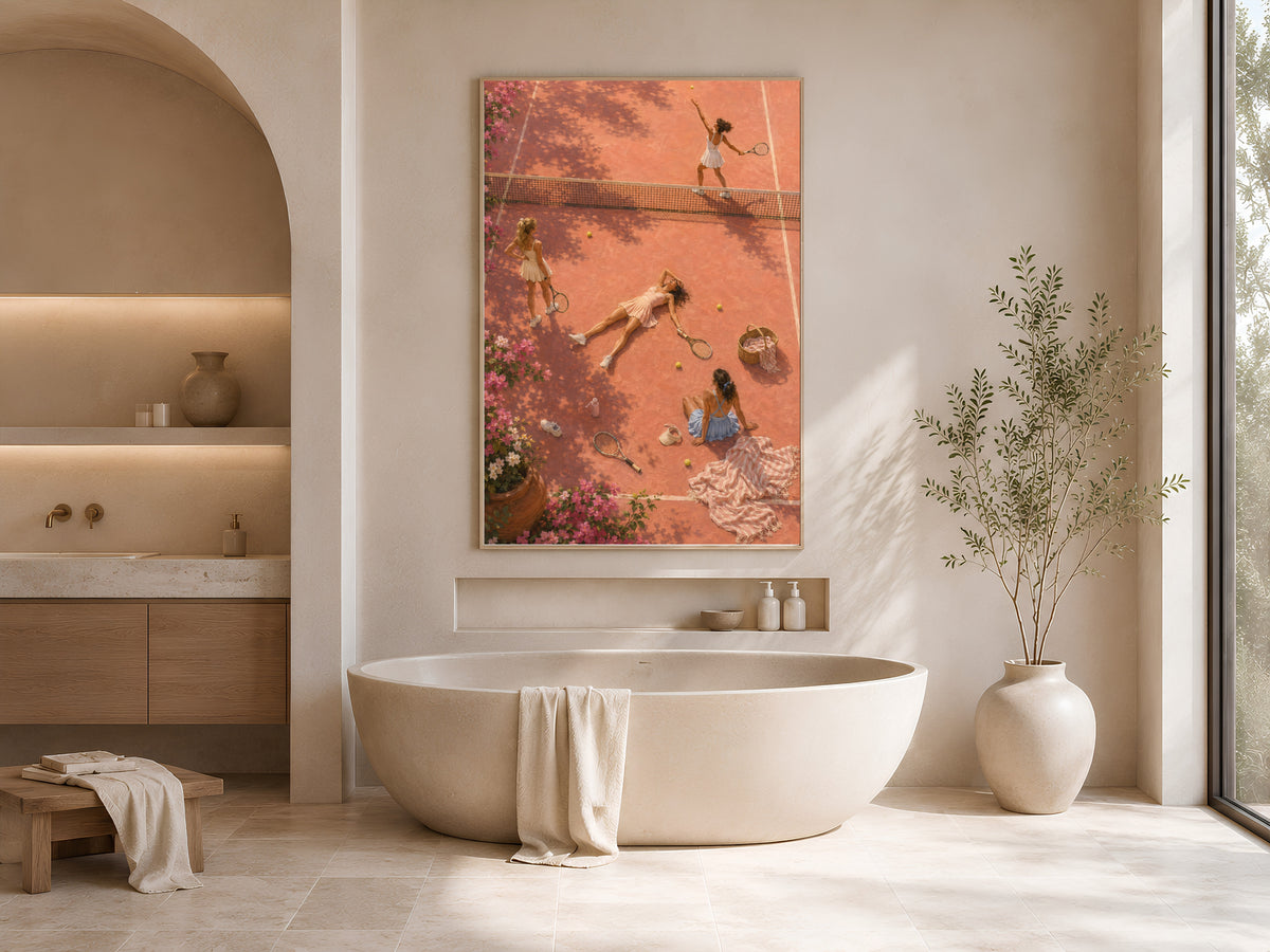Aerial tennis court wall art framed above a freestanding tub in a warm neutral bathroom