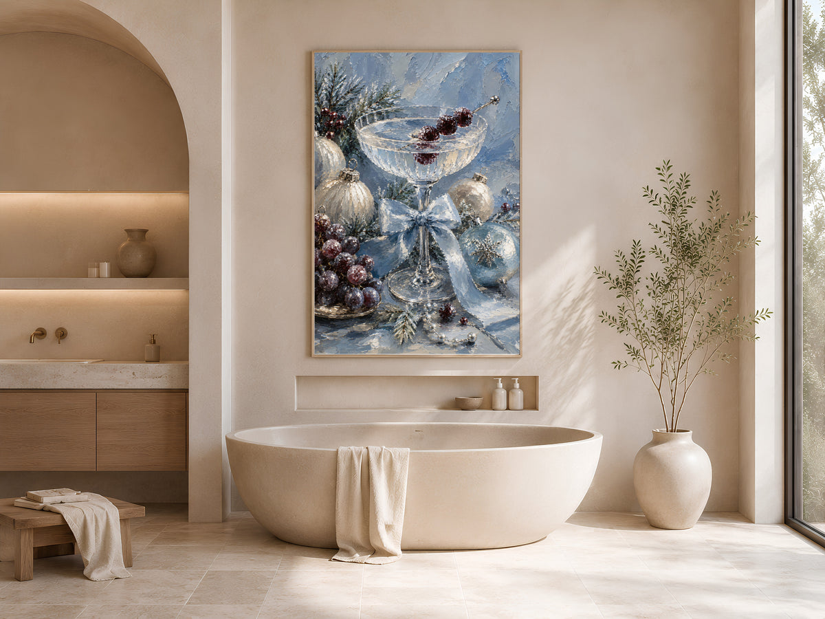 Christmas cocktail wall art framed above an oval soaking tub in a neutral arched bathroom