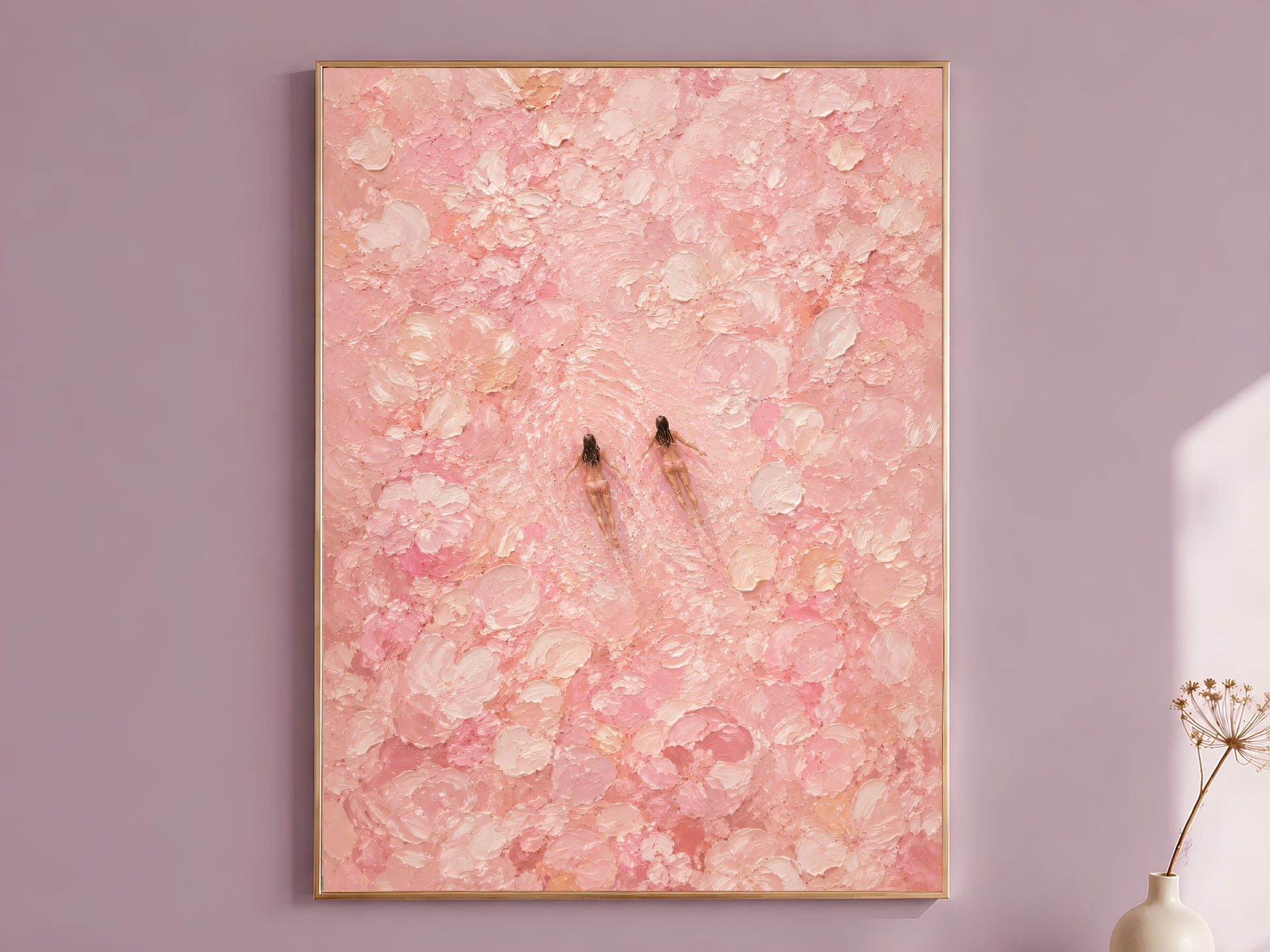 Pink impasto oil painting style wall art in a gold frame hanging on a dusty mauve wall beside a dried allium stem, showing two tiny swimmer figures surrounded by thick chalky blush and cream brushstroke blooms
