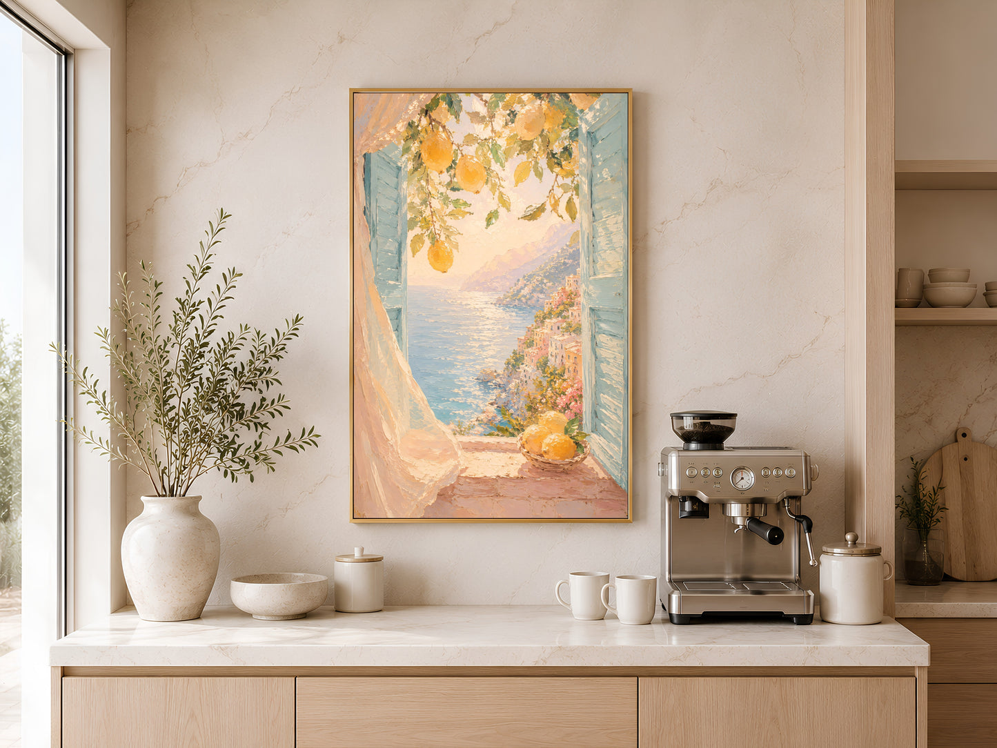 Italian lemon art print in gold frame above a wooden sideboard with coffee machine in a warm neutral kitchen
