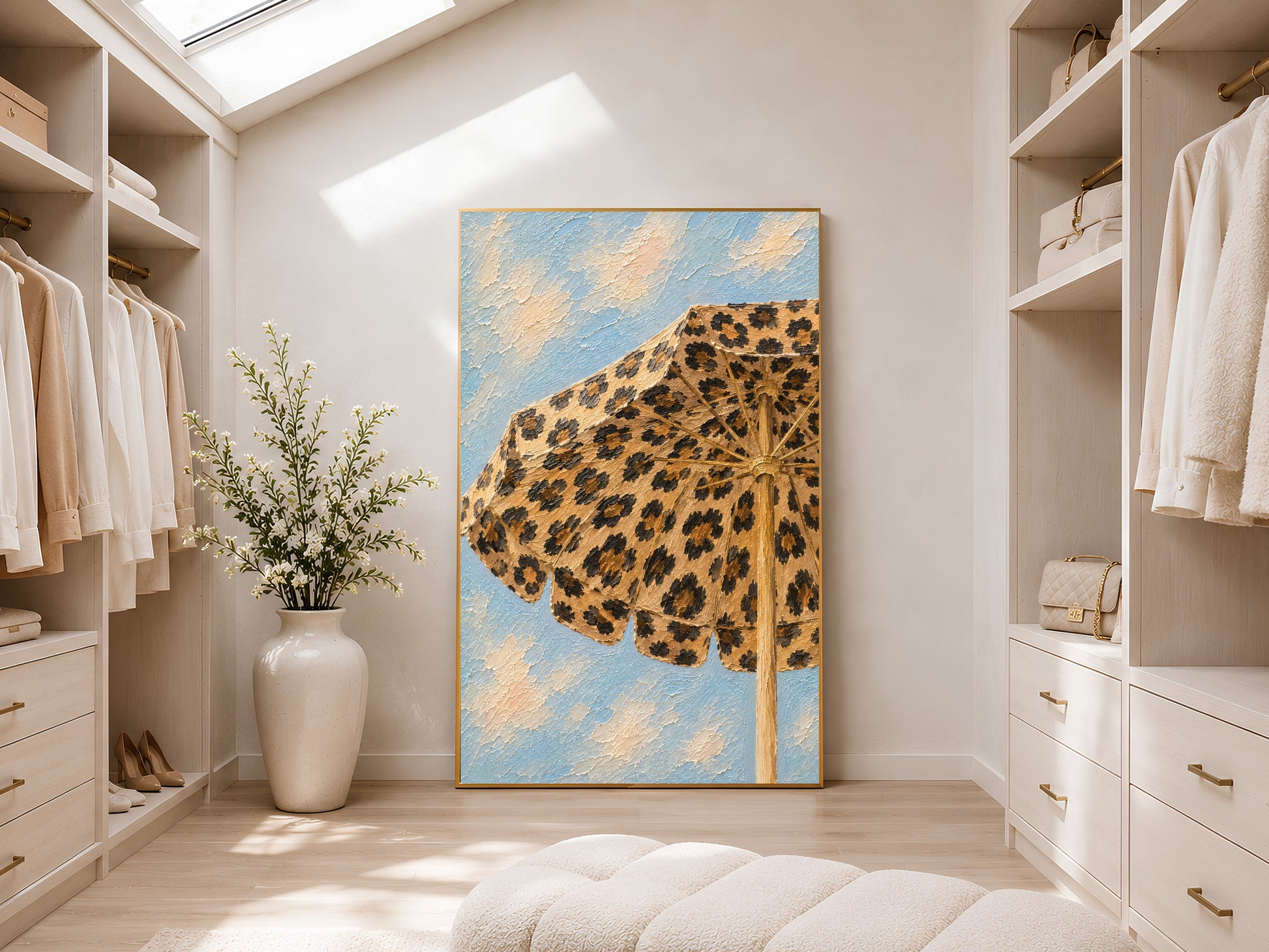 Framed leopard print beach umbrella impasto print in a light-filled walk-in wardrobe with white shelving, tall ceilings and natural light
