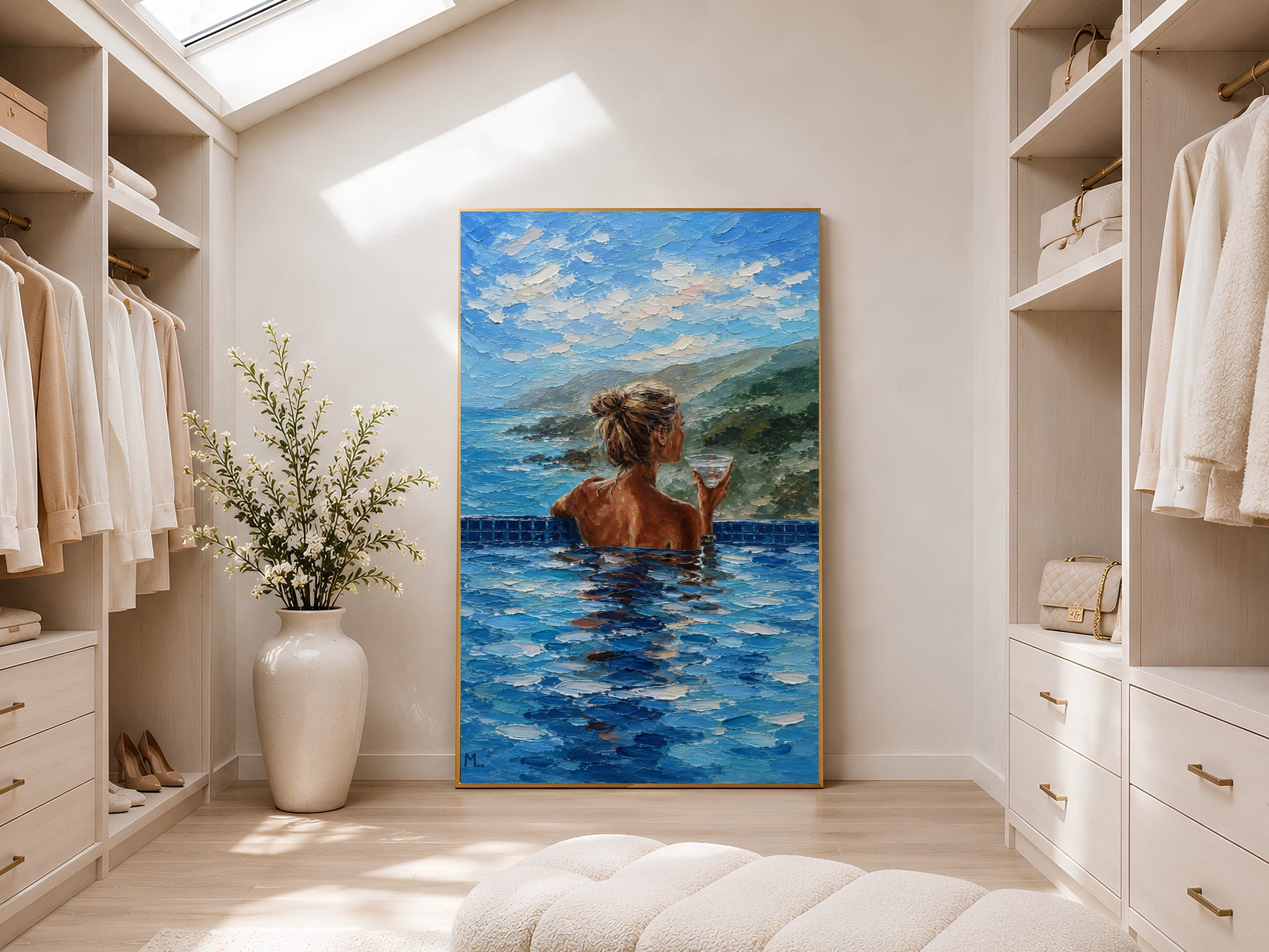 Gold-framed infinity pool woman and ocean view impasto print in a bright walk-in wardrobe with neutral shelving, recessed lighting, and a tall potted plant

