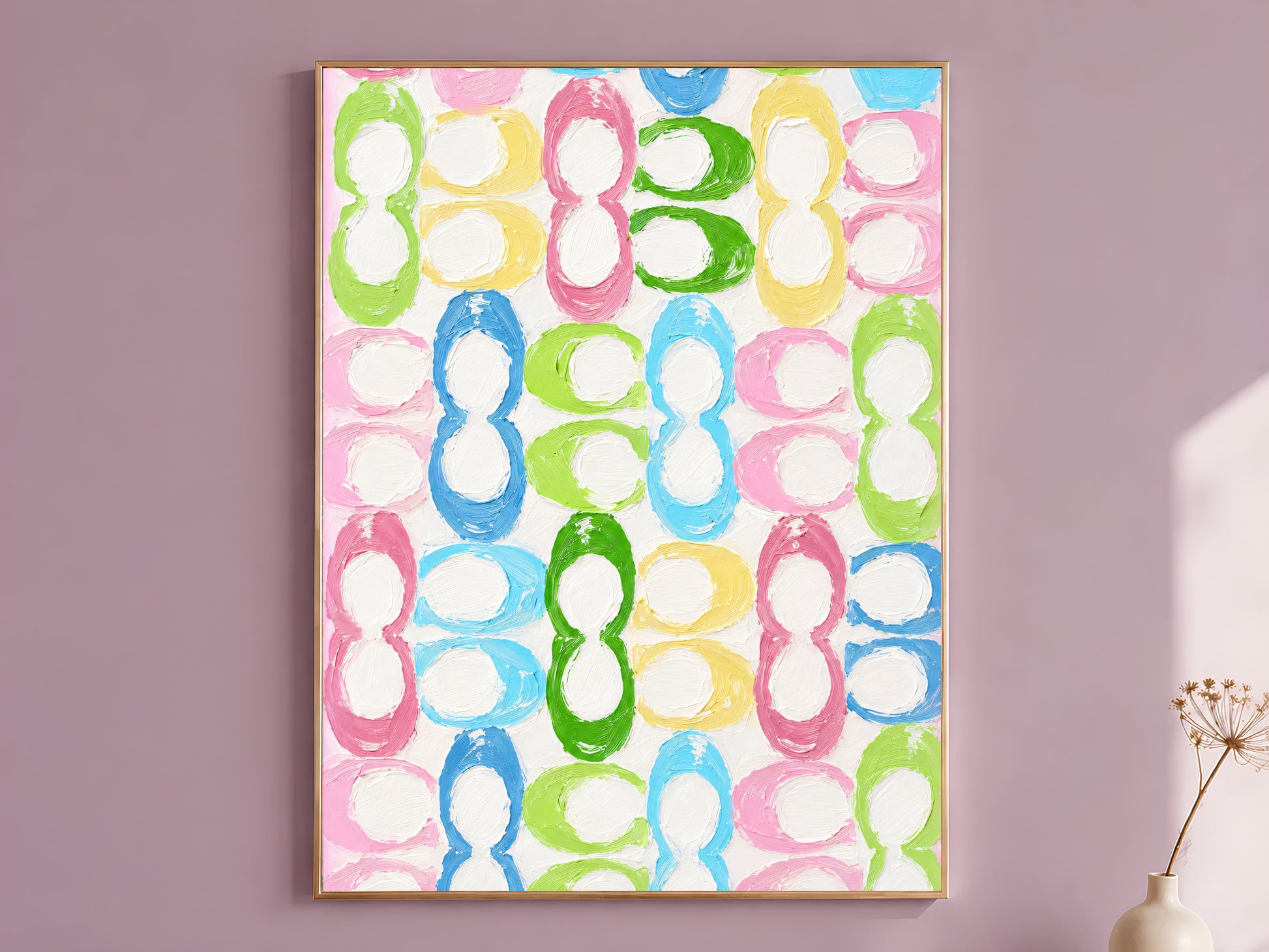 Colorful retro loop pattern dopamine decor wall art in gold frame on mauve wall with dried flower stems
