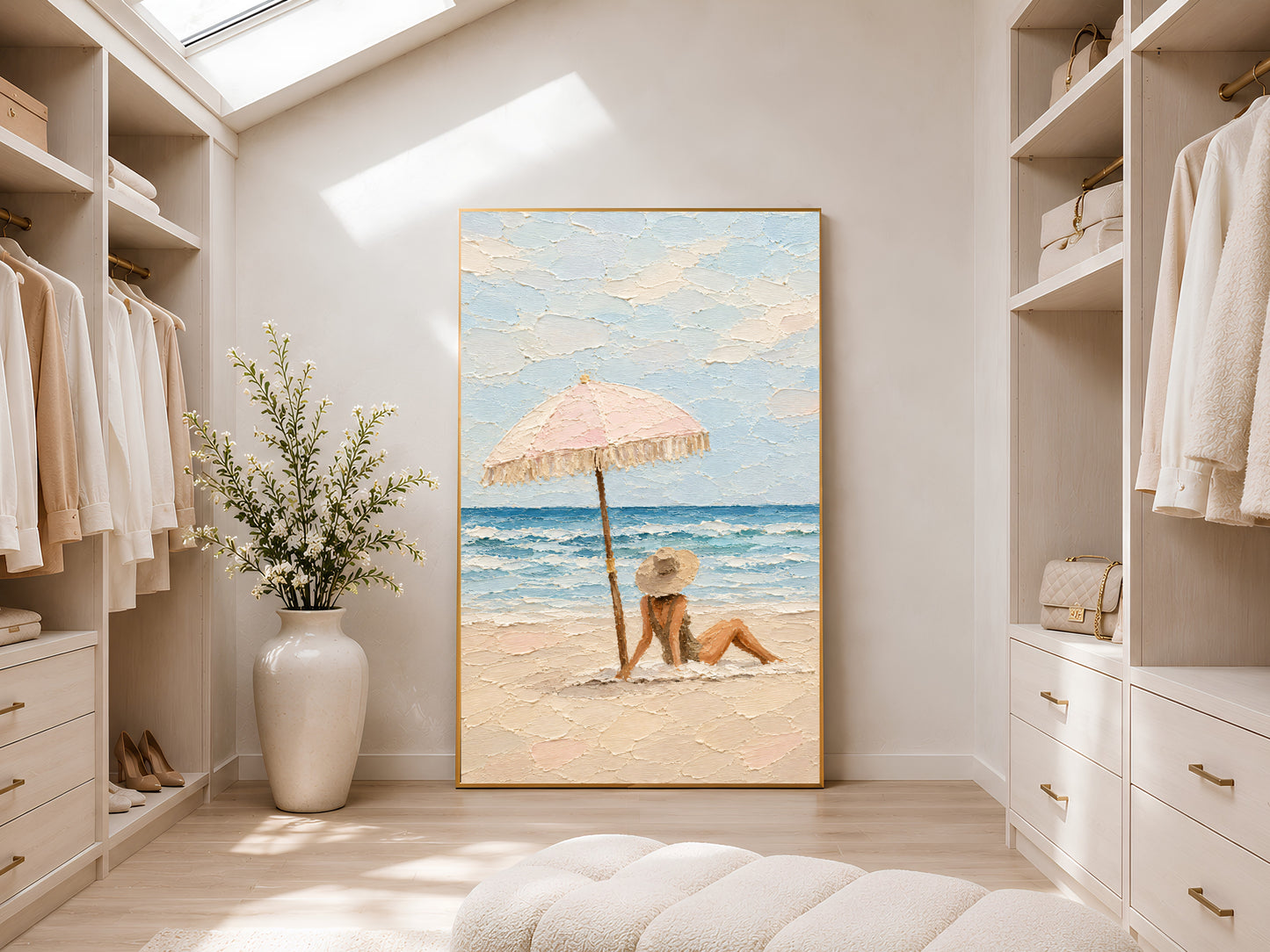 Framed beach scene impasto print leaning in a bright walk-in wardrobe with skylight, white cabinetry, and large ceramic floor vase
