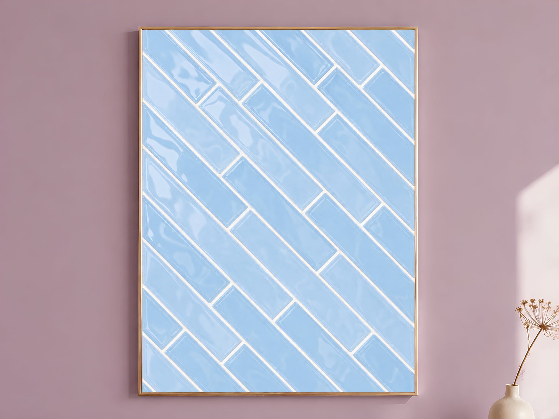 Blue herringbone tile wall art print in a gold frame on a soft mauve wall with a dried flower stem beside it, showing full glossy powder blue ceramic tile pattern with white grout lines
