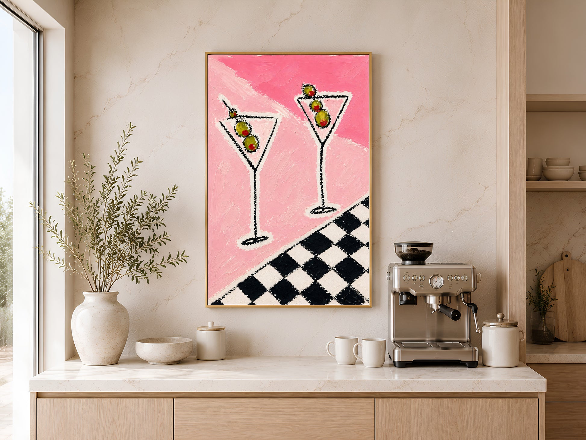 Framed impasto martini print on warm beige wall above console table with coffee maker and white vases in minimal kitchen

