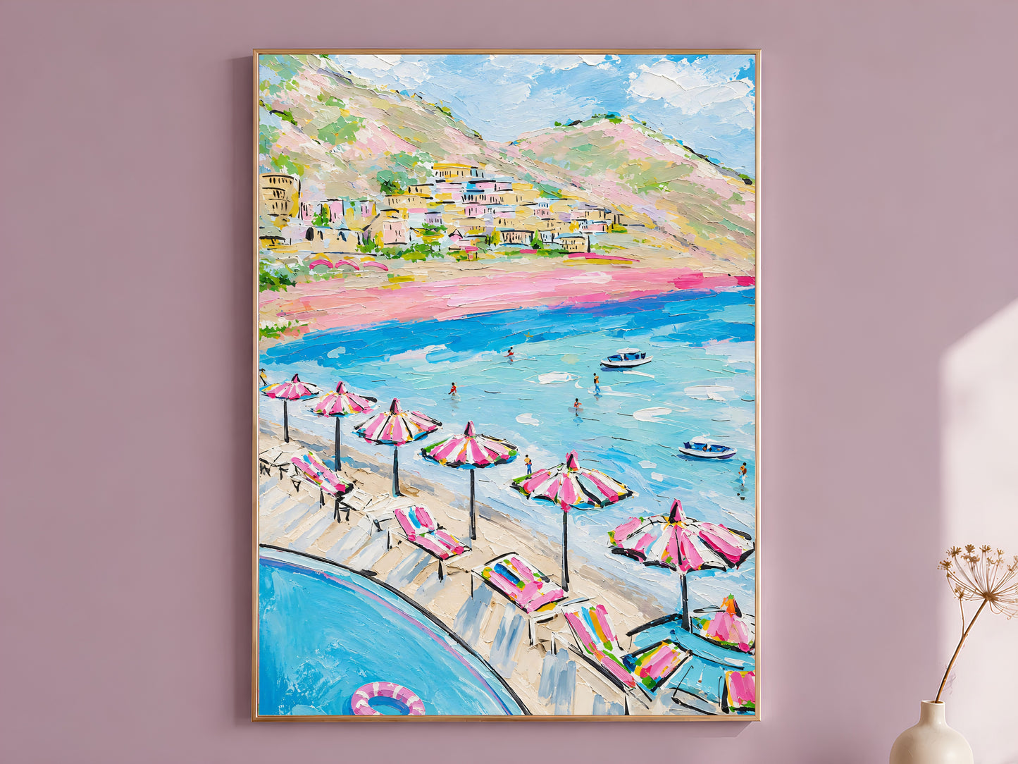 Colorful impasto oil painting style Positano beach wall art print in a thin wood frame displayed against a dusty mauve wall, showing pink striped umbrellas, turquoise water, swimming figures, boats, and Amalfi Coast cliffside village