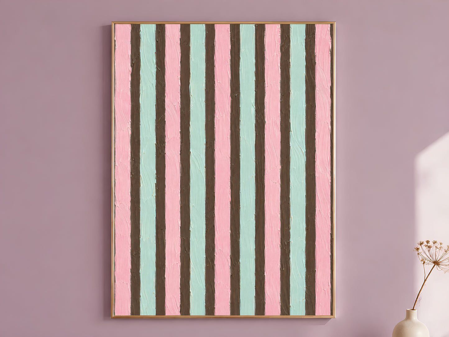 Pink mint mocha candy stripe impasto wall art in gold frame on mauve wall with dried flower stems
