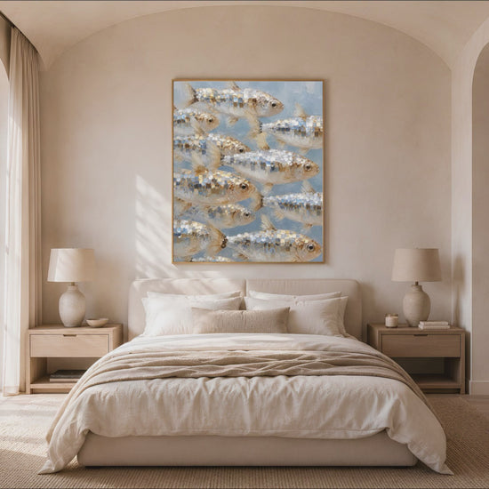 School of fish wall art hung in a sunlit bedroom with arched window, coastal nautical impasto painting print