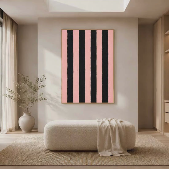 Bold pink and black stripe print in gold frame in bright dressing room with large window white cabinetry and vase (video)
