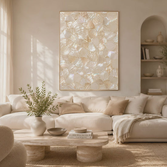 Video preview of ivory champagne shell mosaic wall art above a sofa in a sunlit living room