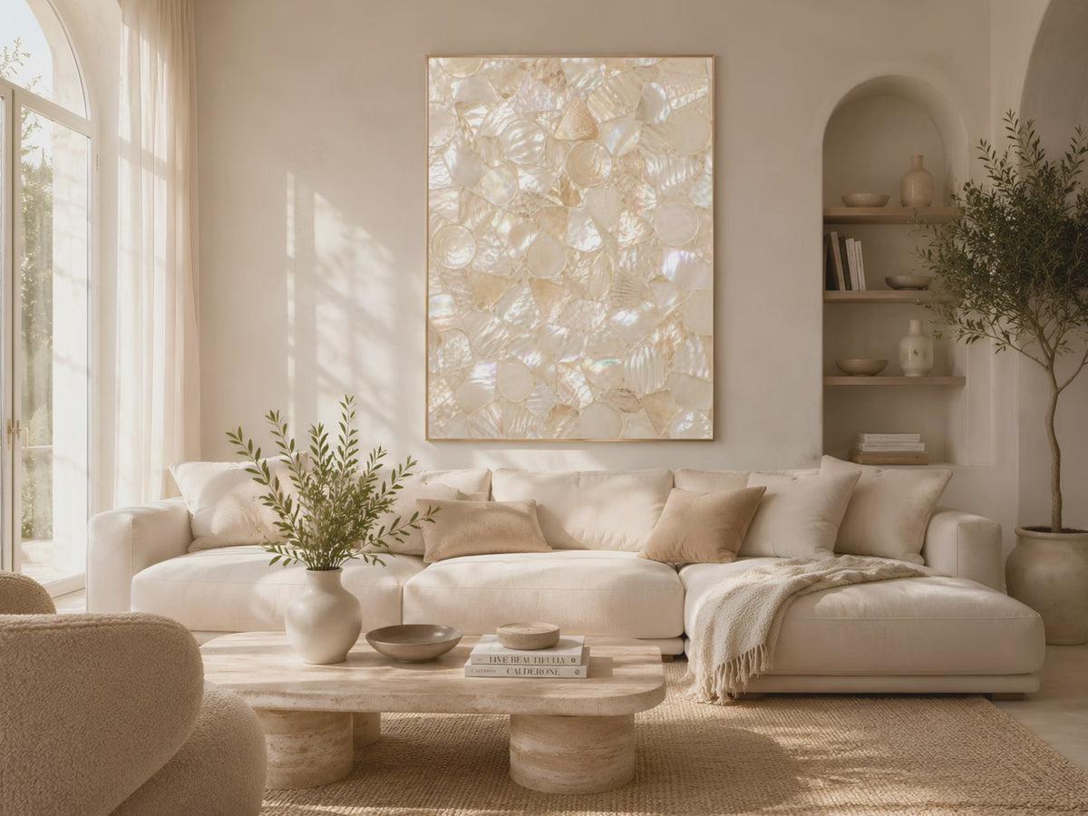 Video preview of ivory champagne shell mosaic wall art above a sofa in a sunlit living room