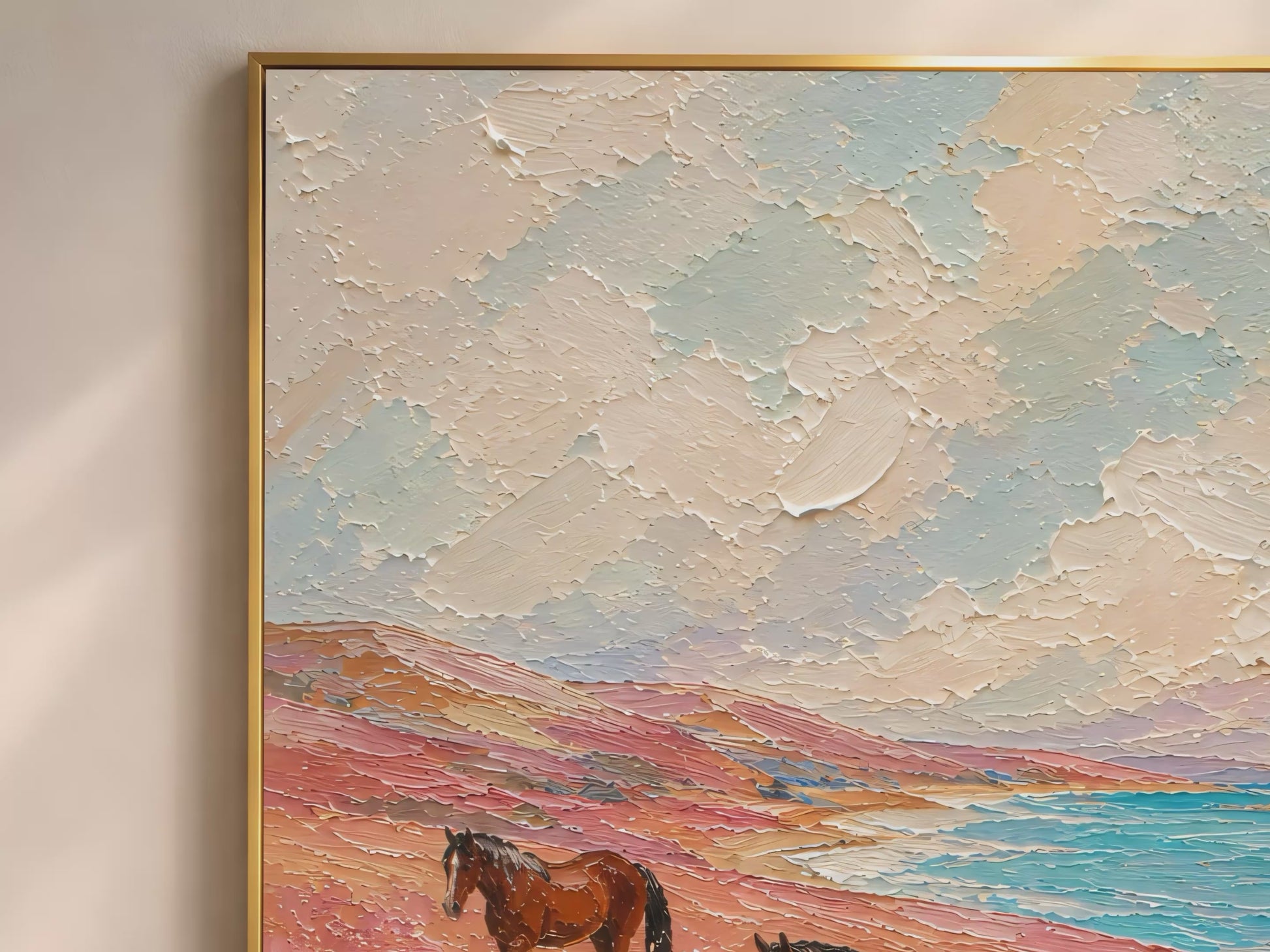 Three chestnut horses in a coastal floral meadow impasto oil painting video mockup thumbnail showing the full painting with turquoise ocean, pink wildflowers, and creamy impasto sky in a warm interior setting
