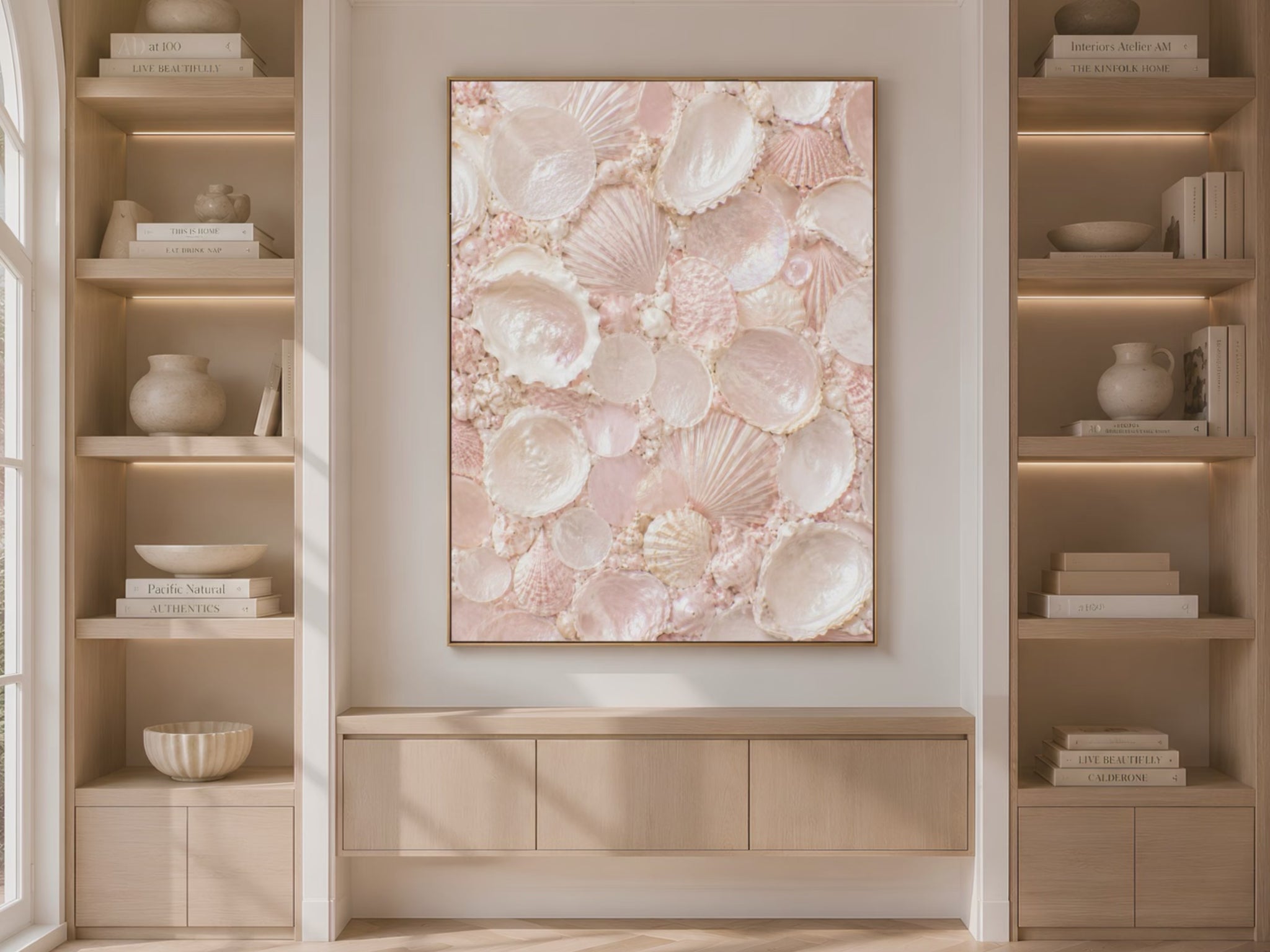 Video preview of blush pink seashell mosaic wall art displayed on a bookshelf wall
