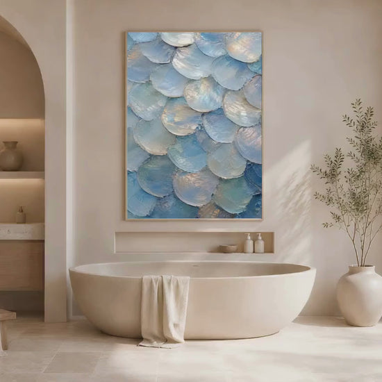 Video of iridescent capiz shell wall art framed in gold above a bathtub in coastal bathroom
