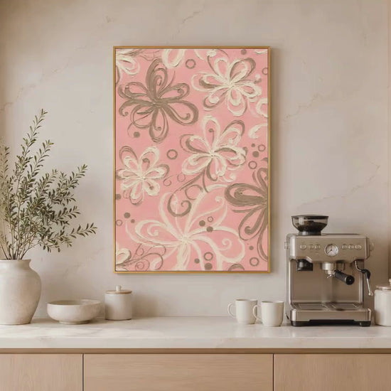 Pink retro swirl floral wall art in gold frame above bathroom vanity with plants and warm lighting (video)
